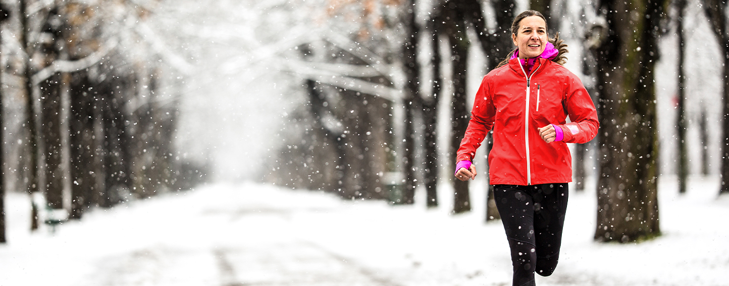 Woman jogging in snow